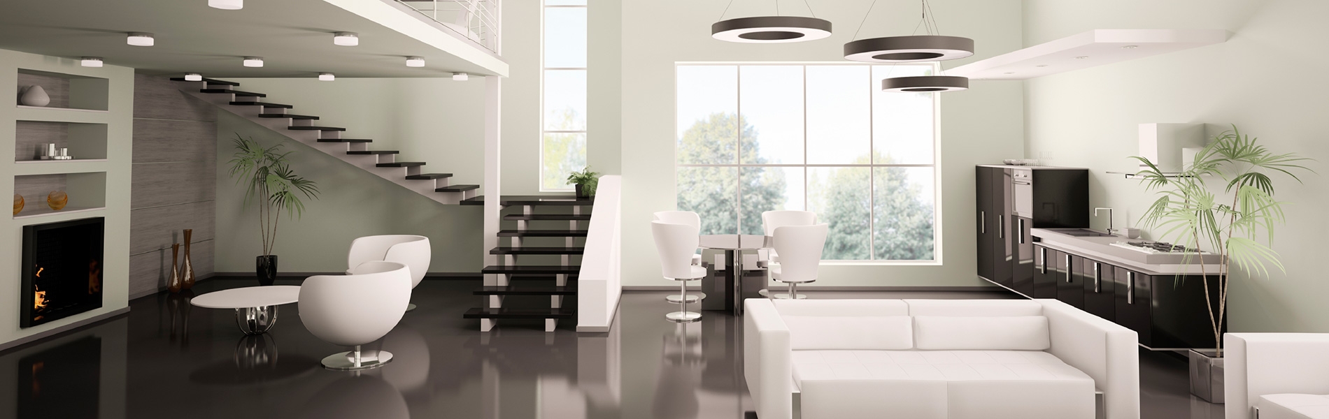 Modern open concept luxury living space with floating staircase and kitchen